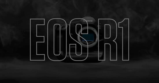 Image of a Canon EOS R1 camera body on a dark, smoky background. The text "EOS R1" is overlaid in large, transparent letters, revealing the camera through the letters. The design emphasizes the camera model while keeping the overall image dramatic and minimalist.